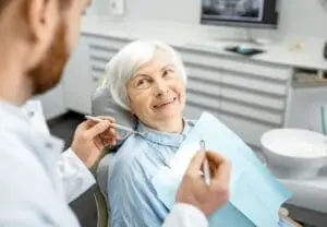 Older woman getting dental checkup at Byrne Dental