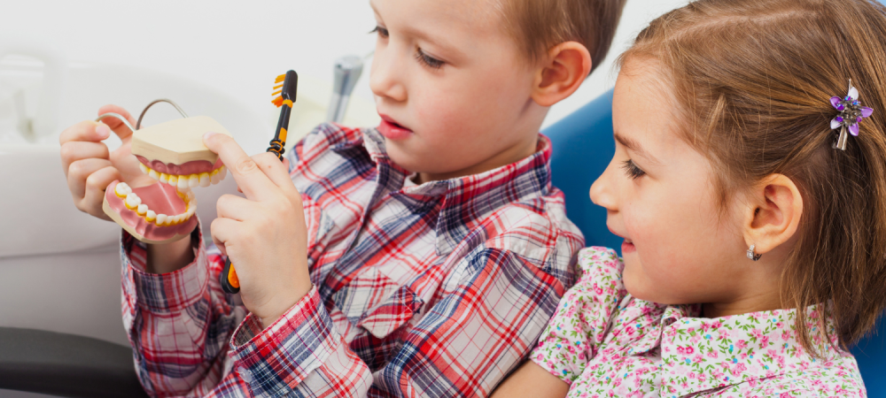 Children a the dentist getting an annual dental check up and teeth cleaning