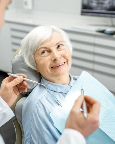 Older woman getting dental checkup at Byrne Dental