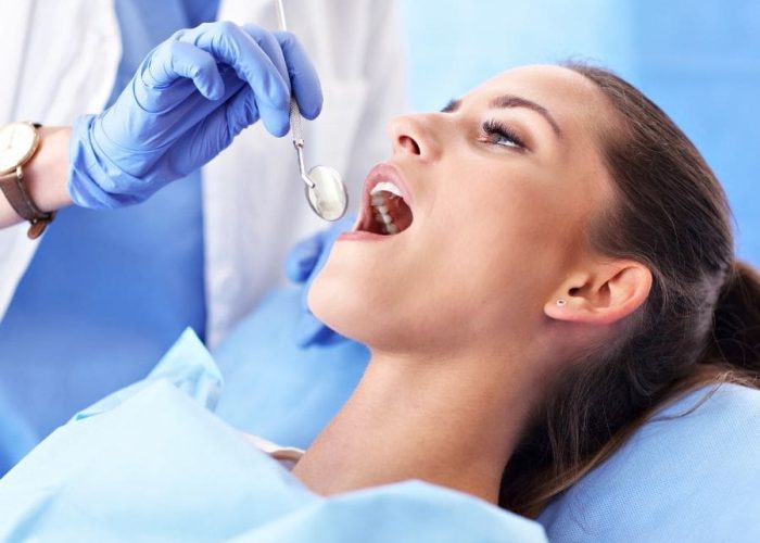 Woman at Rapid City dentist being seen for root canal treatment