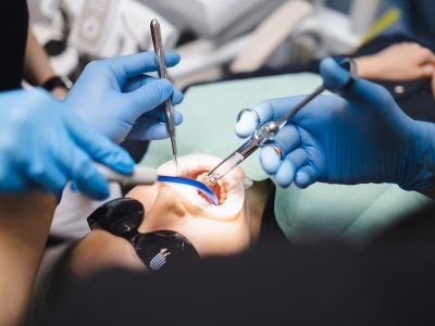 Giving anesthesia to the patient before dental surgery at Byrne Dental